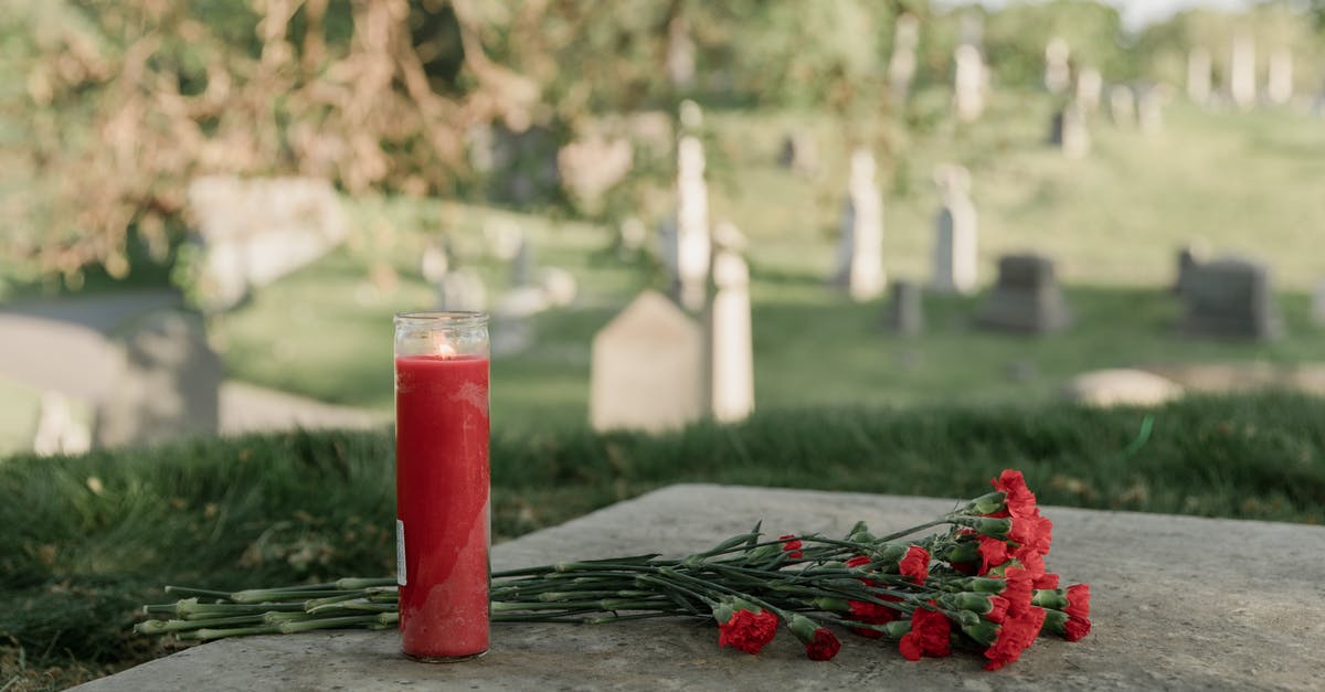 Why did she bring flowers to the tomb? - Red Candle and Flowers On A Tomb