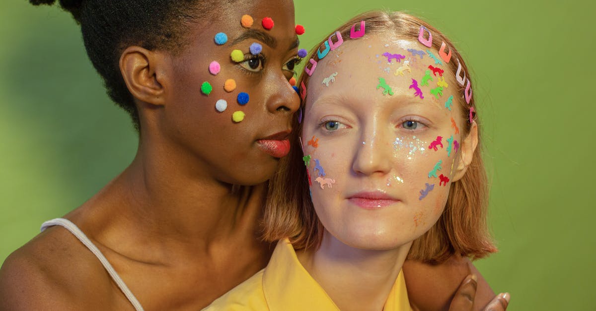 Why did so many cats appear in this scene? - Multiracial women with colorful decorations on faces
