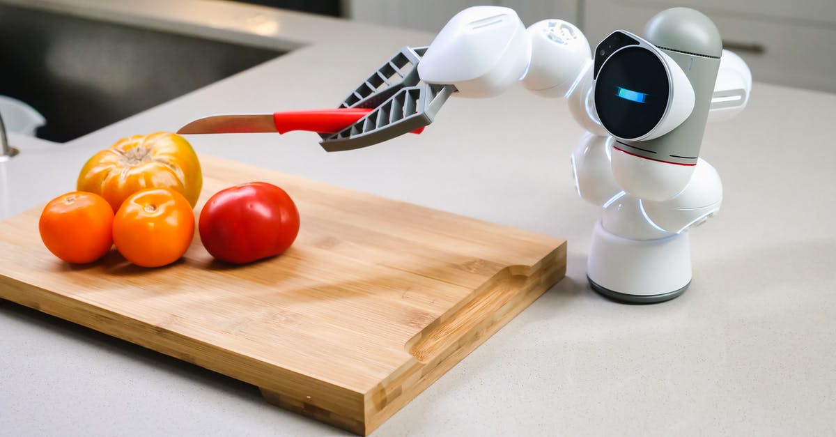 Why did the A.I. defy its creator in Ex Machina? - White and Black Robot Toy on Brown Wooden Chopping Board