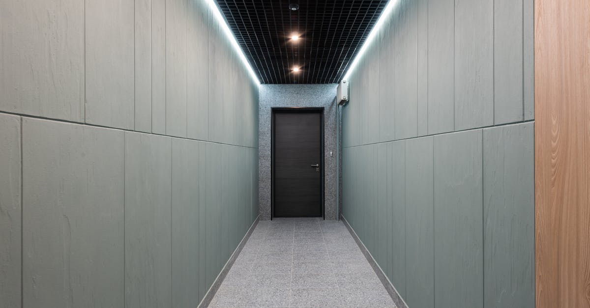 Why did the hero take the long way around for her kill? - Long corridor in modern office