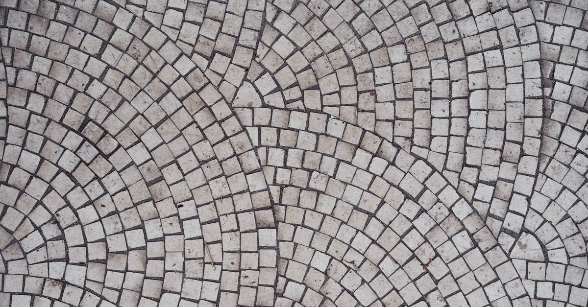 Why did the Tethered form a line in Us? - Mosaic old gray ceramic tile with round pattern