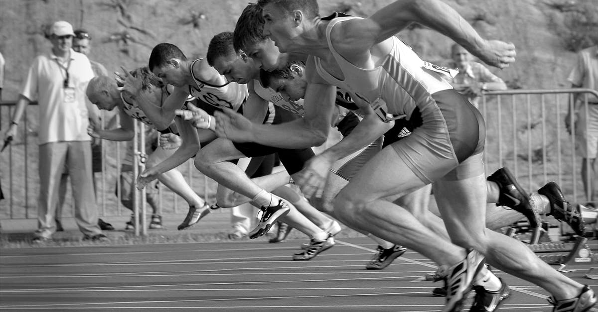 Why did they start the war? - Athletes Running on Track and Field Oval in Grayscale Photography