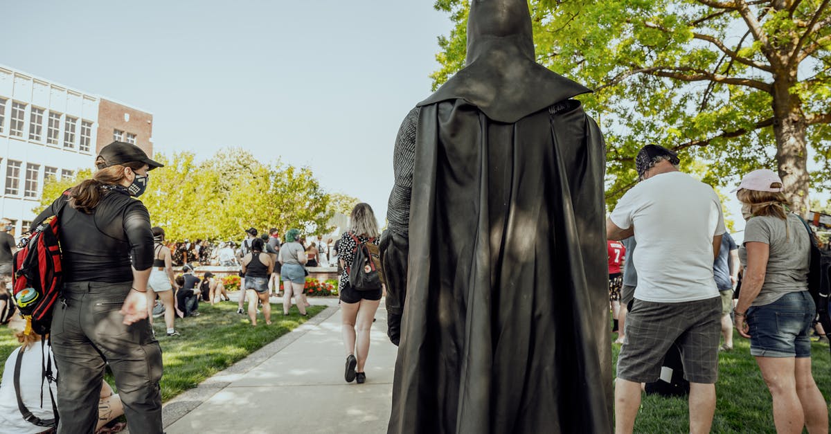 Why did this character lose his power at the end? - Anonymous person in superhero costume walking in park