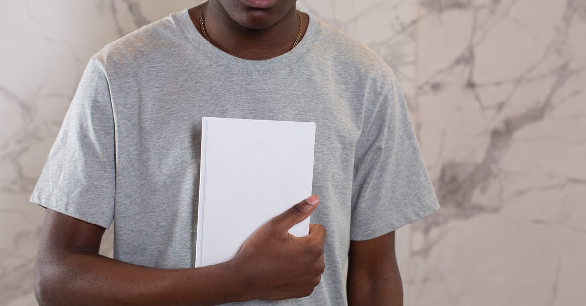Why didn't Hannah notice this? - Crop black man with mock up notebook