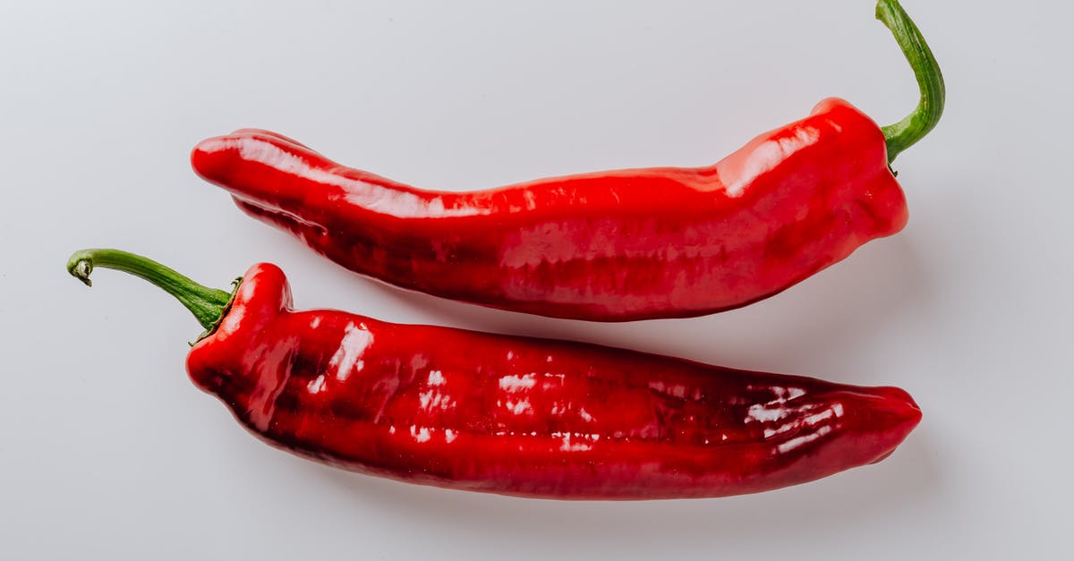 Why didn't Hannibal destroy the whole note/letter received from the dragon? - From above of pair of hot chili peppers with green sprouts and smooth surface put on white table