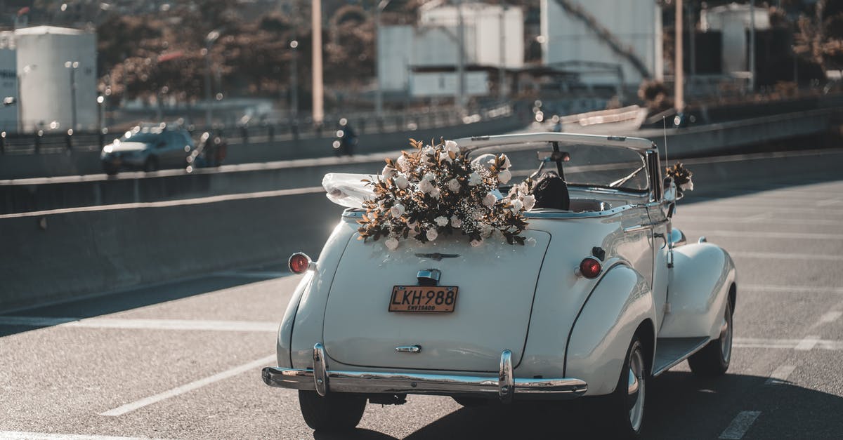 Why didn't R and Julie just drive away? - Retro wedding cabriolet driving on road