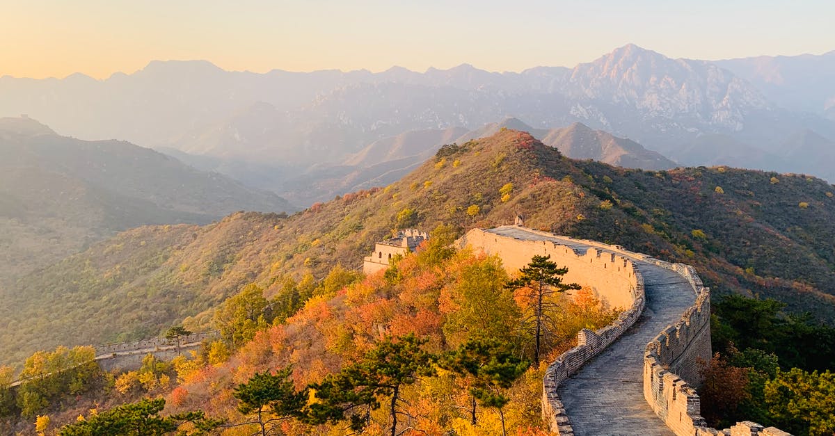 Why didn't the great stone dragon wake in Mulan? - Picturesque landscape of Great Wall of China on hill with green trees and mountains on background on sunny day