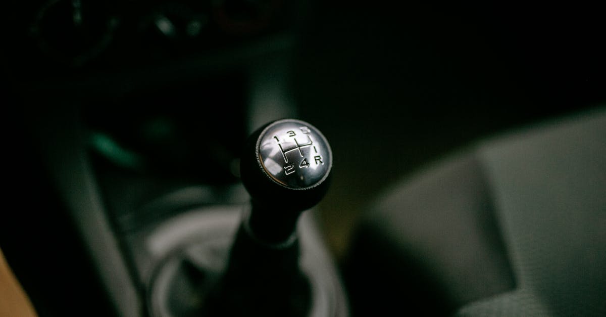 Why didn't the Joker's goons know who he was in the car (the Dark Knight intro) - Black and Silver Car Gear Shift Lever