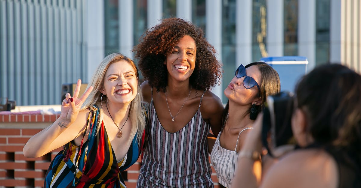 Why didn't V defend himself as soon as Peter Creedy and henchmen started shooting V? - Unrecognizable female photographer taking picture of cheerful young multiracial female friends smiling and showing V sign during party on modern building rooftop