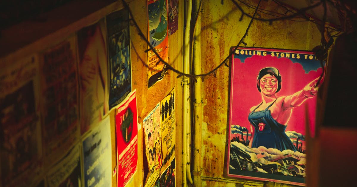 Why different footage was used for "Garcon, coffee" callback - Vintage posters and on shabby rusty wall