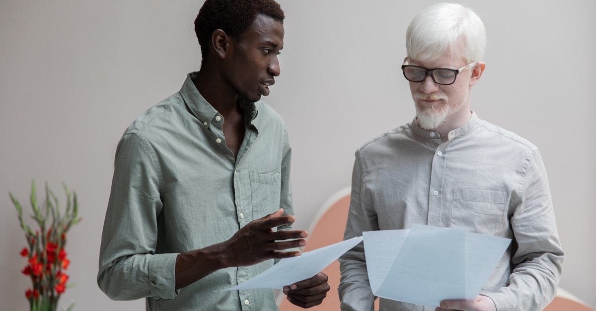 Why do Amenadiel and Lucifer speak with different accents? [closed] - Concentrated African American man and albino coworker in eyeglasses working with papers while discussing work in contemporary office with flower