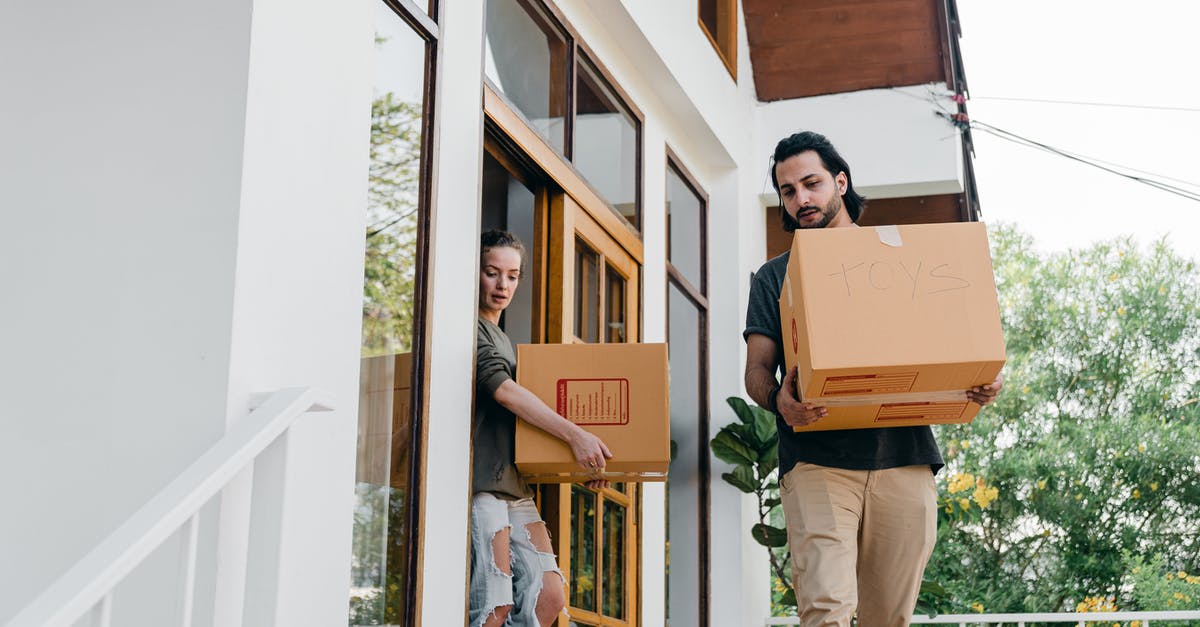 Why do Michael and Penelope not let Alan and Nancy Cowen leave their house? - Couple carrying carton boxes while moving out of old home