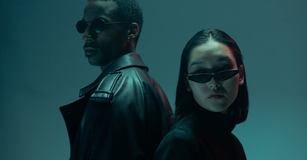 Why do people wear sunglasses in The Matrix? - Man in Black Jacket Wearing Sunglasses Beside Woman in Black Jacket