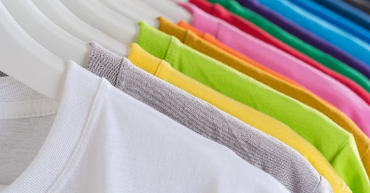 Why do so many Dunder Mifflin employees wear overcoats? [closed] - Closeup bright multicolored soft cotton t shirts hanging on rail in well organized wardrobe