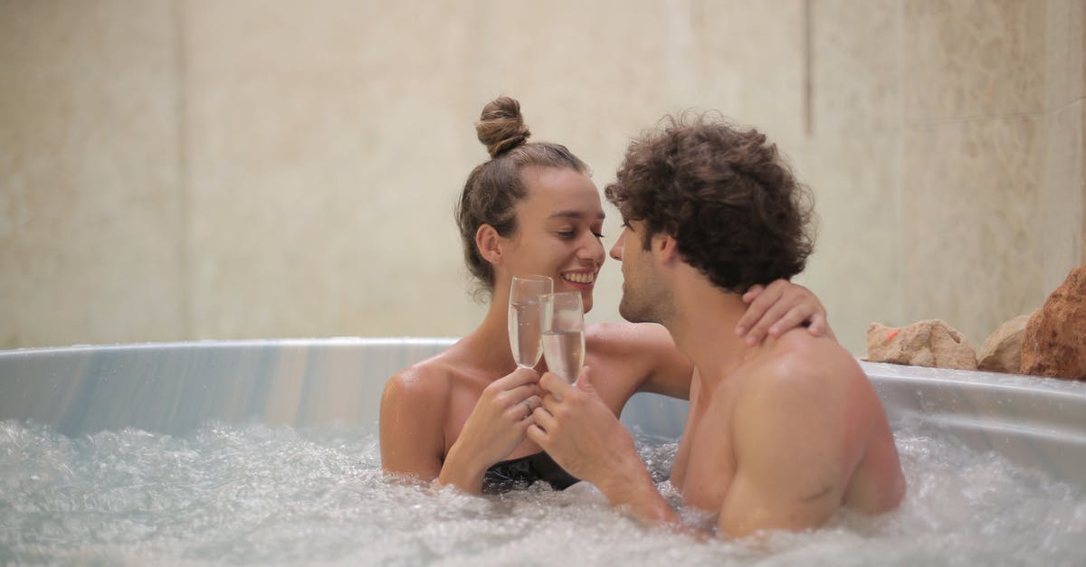 Why do the guards in The Grand Budapest Hotel shoot at each other? - Happy couple having fun in jacuzzi during romantic date