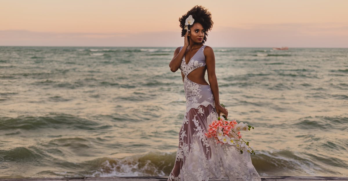 Why does Anzor walk away? - Stylish black bride with flower bouquet walking near ocean