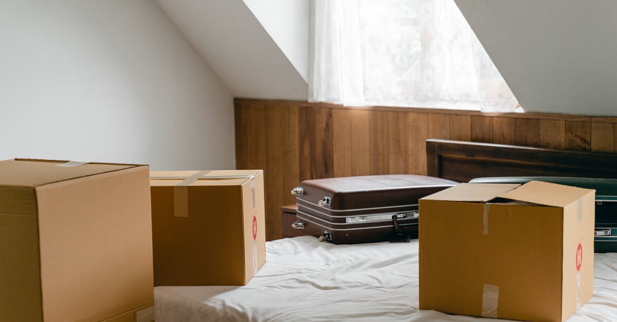 Why does Borden want to change the knot used in the trick? - Small cardboard boxes and leather cases placed on bed with sheet near big box in light room of house under sloping roof