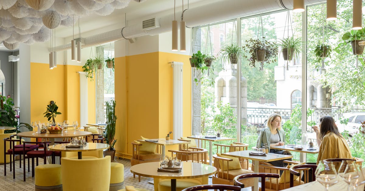 Why does Cassius Green speak like this? - Women in modern cafe with stylish bright interior