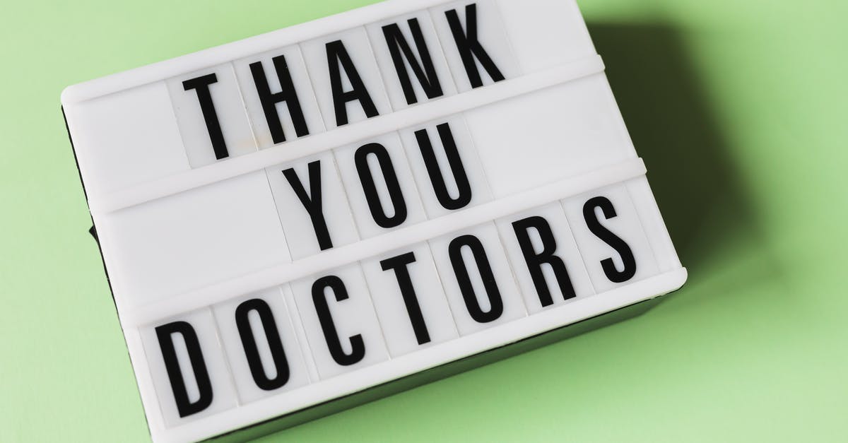 Why does Chang care so much Mei has left the company? - From above of vintage light box with THANK YOU DOCTORS gratitude message placed on green surface