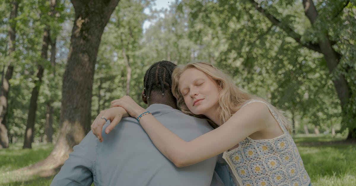 Why does David go back instead of just telling Christina that he has feelings for her? - Woman Hugging a Man in the Park