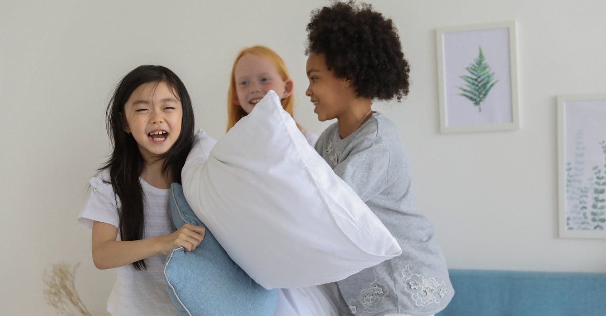 Why does Doc Holiday want to fight Wyatt in My Darling Clementine? - Happy diverse children having pillow fight while laughing cheerfully on bed in daytime