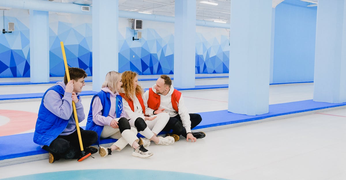 Why does Ice Bear talk in the third person? - Sportsmen in red and blue waistcoats chatting on floor of spacious curling arena