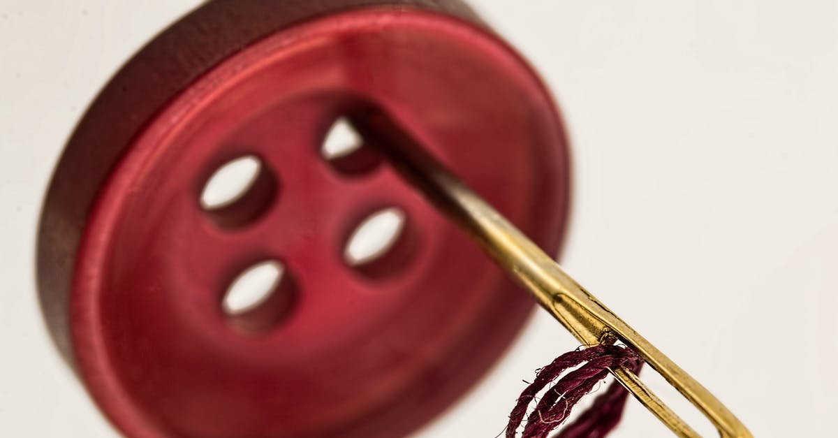 Why does Master Ip want to sew a button onto a paper? - Brass Needle Through Red Cloth Button