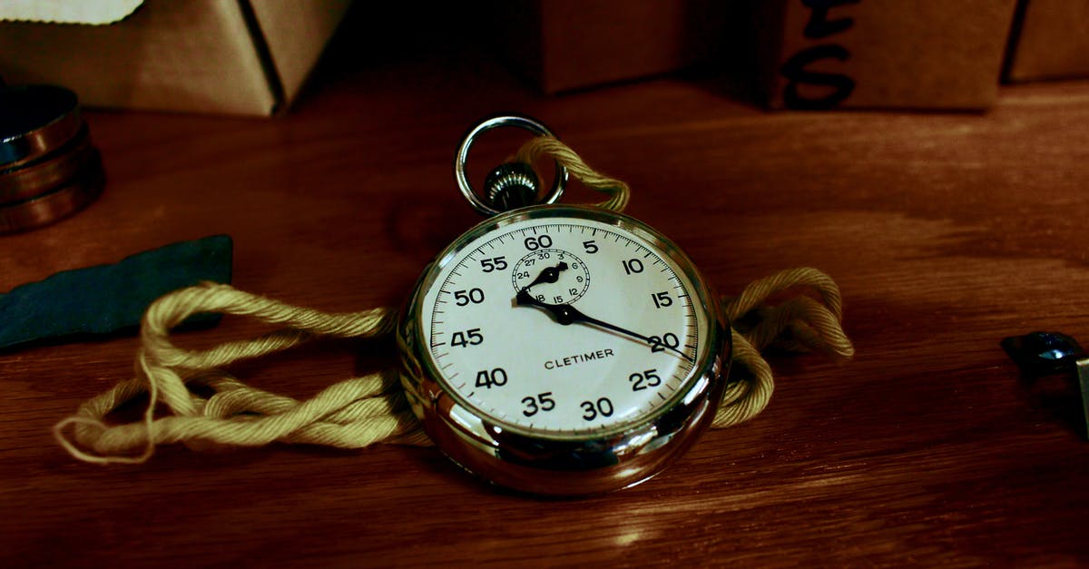Why does McCall time himself with the stopwatch in a lot of scenes? - White Pocket Watch With Gold-colored Frame on Brown Wooden Board