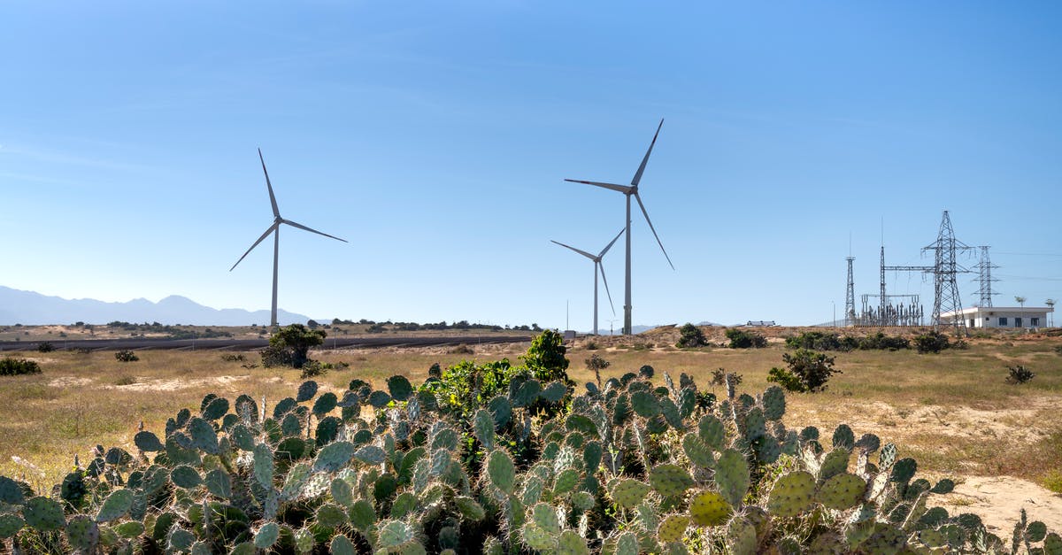 Why does removing Tony Stark's power source weaken him? - Wind mills on land against cacti in countryside