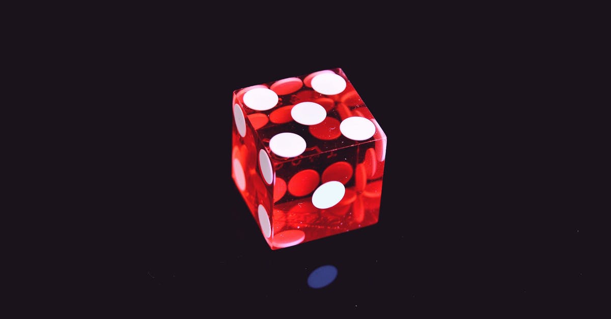 Why does Roy Batty die in 2019? - Red Translucent Die on Top of Black Surface