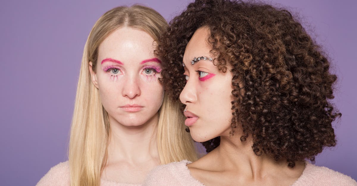 Why does SkekMal not appear to need the crystal to remain alive? - Young serious multiracial female friends in sweaters and colorful pink makeup on face in bright studio on violet background