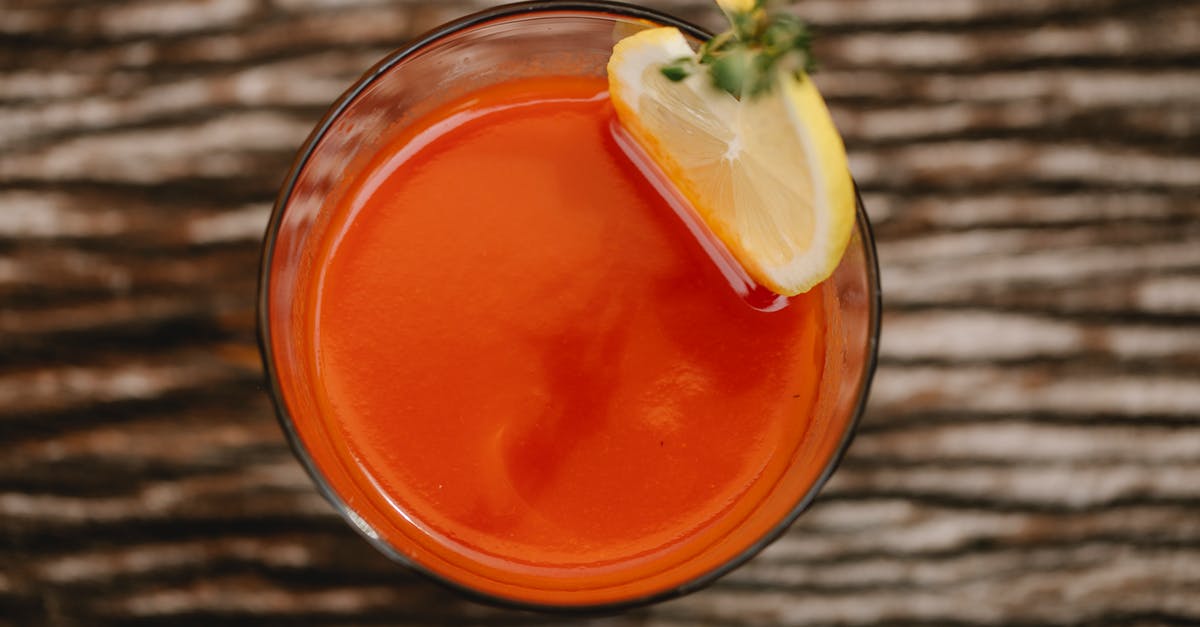 Why does the crew get infected from the Vodka in Leviathan - From above of colorful tasty alcoholic drink with tomato juice and thyme sprig on top of glass