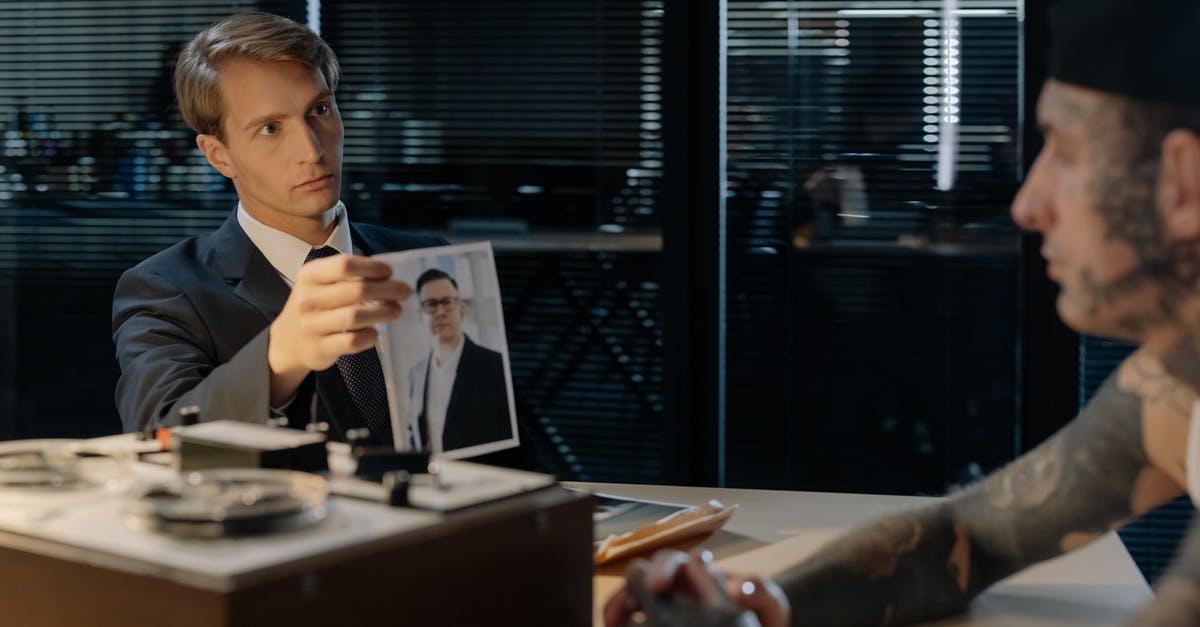 Why does the detective suspect the principal in The Kid Detective (2020)? - A Detective Showing a Photo of the Victim