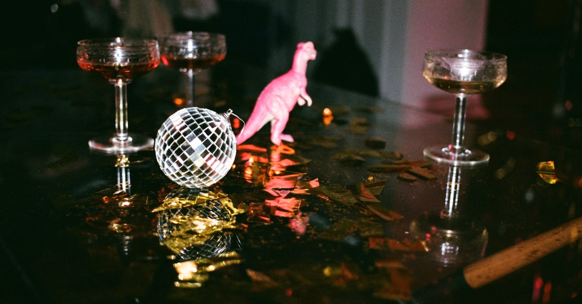 Why does the dinosaur let the wounded dinosaur live? - Round Gray Mirror Ball Beside Dinosaur Toy