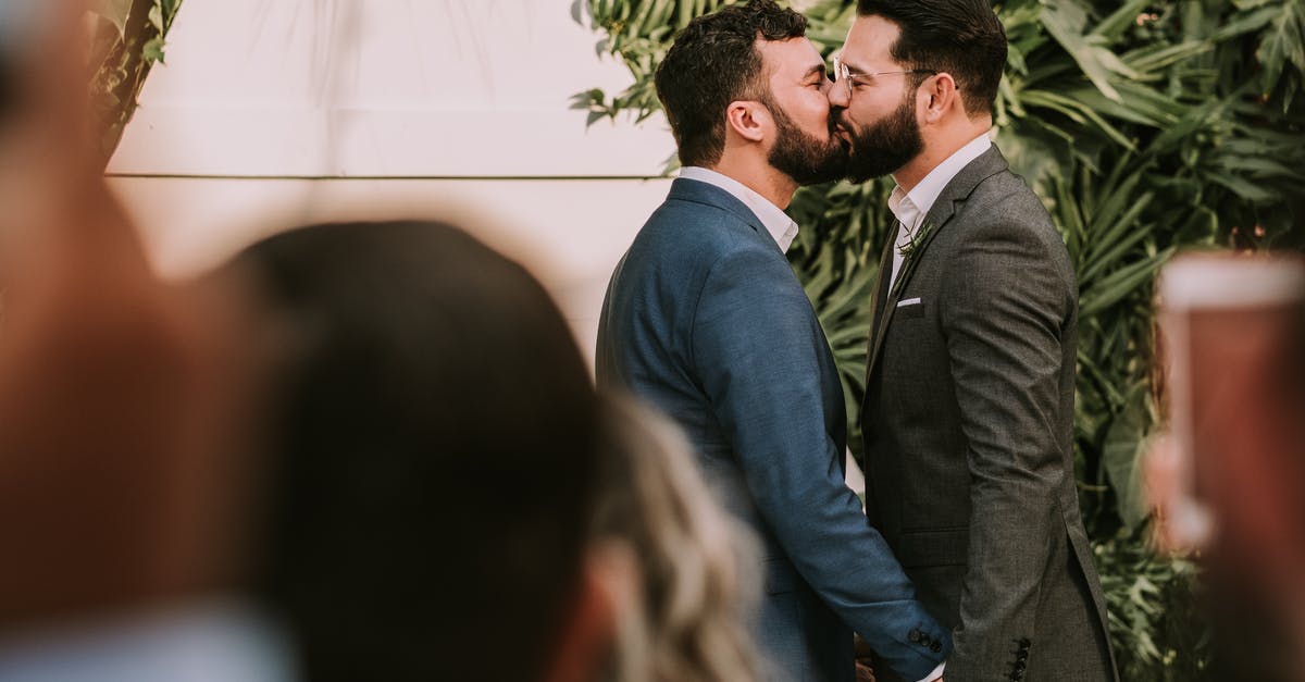 Why does the husband leave the family in The Others? - Men Wearing Suit Kissing in Front of People