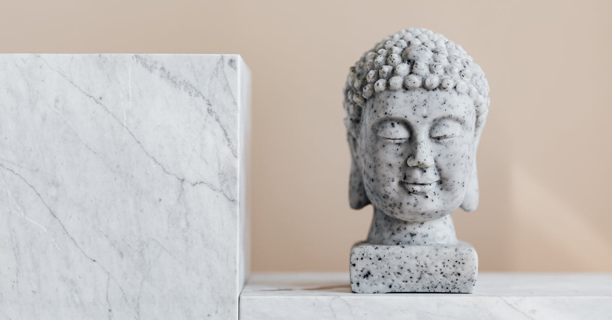 Why does the Mind Stone still affect Vision after Shuri spent all that time separating it? - Traditional stone Buddha statue on marble shelf