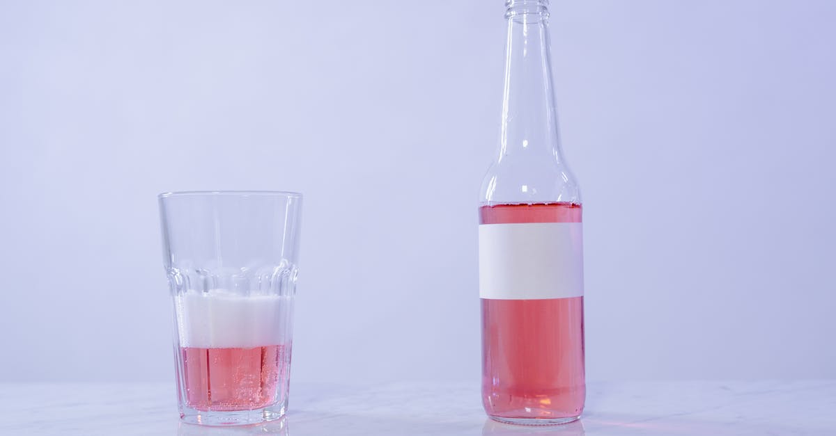 Why does TV shows always make a full drink sound like an almost empty one? - Clear Glass Bottle With Red Liquid