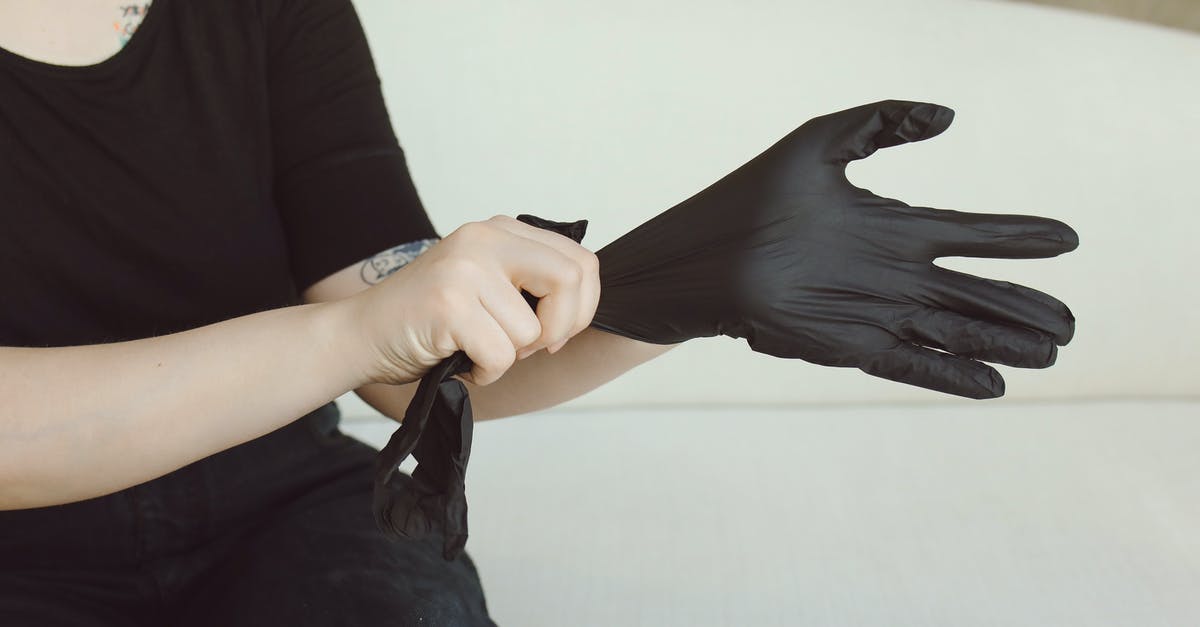 Why does Tyrell Wellick put on latex gloves in Elliot's apartment? - Person in Black Long Sleeve Shirt Holding Black Leather Bag