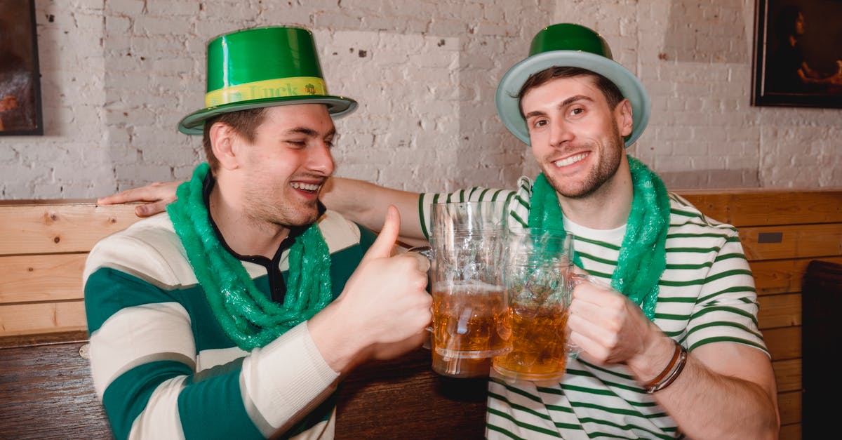 Why does Young Sheldon behave like an adult while Adult Sheldon behaves like a kid? - Happy friends clinking mugs of beer on Saint Patricks Day
