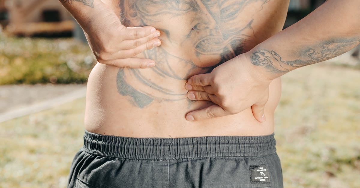 Why doesn't Tig have the Sons of Anarchy tattoo on his back similar to Jax? - A Person with Back Pain