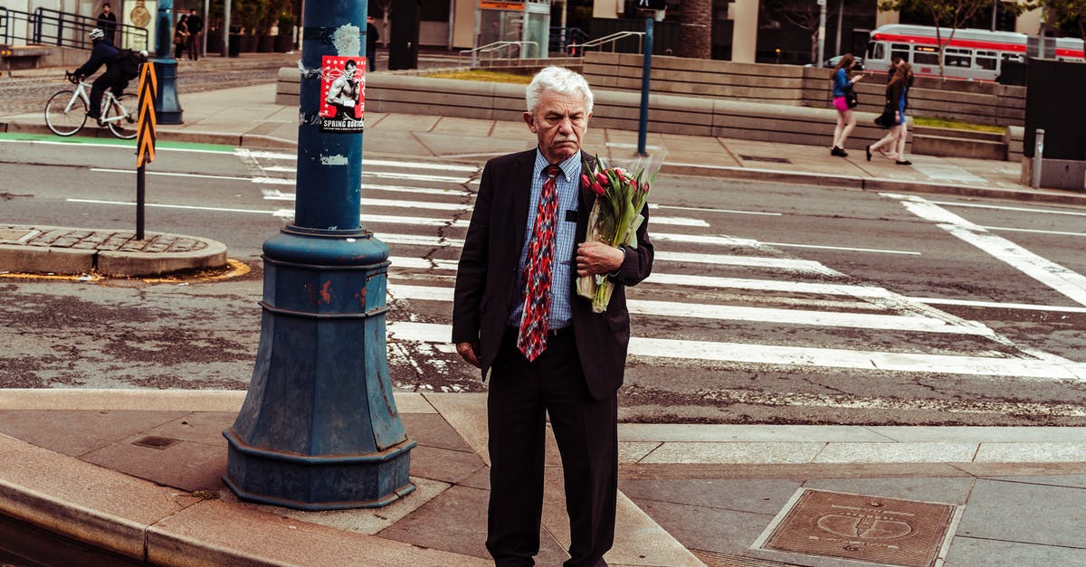 Why don't General Zod's people seem to age? - Man Holding Bouquet of Red Roses