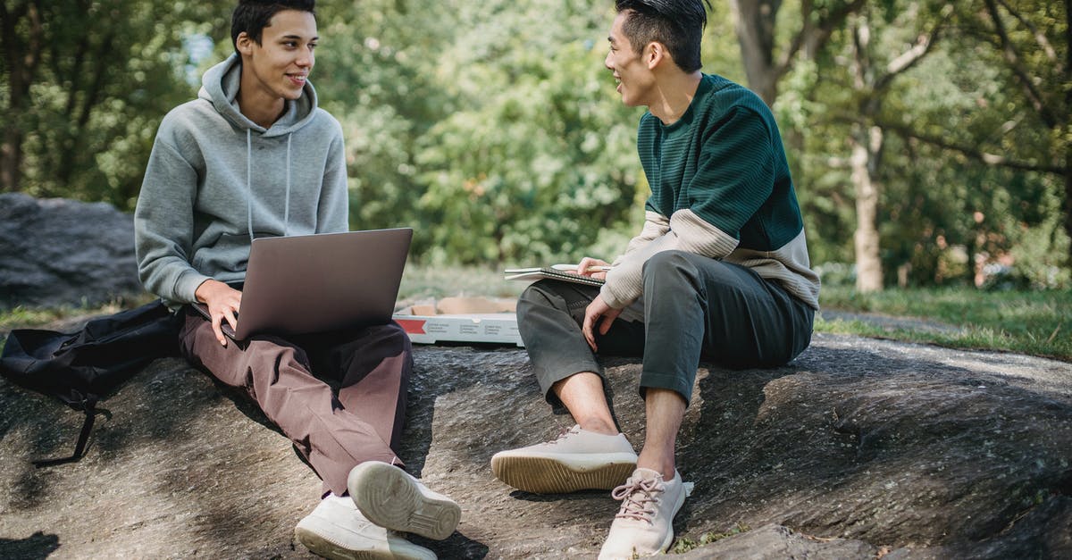 Why don't the team ever bring back other species for study? - Full body of positive multiracial classmates sharing information on university assignment while browsing laptop in nature