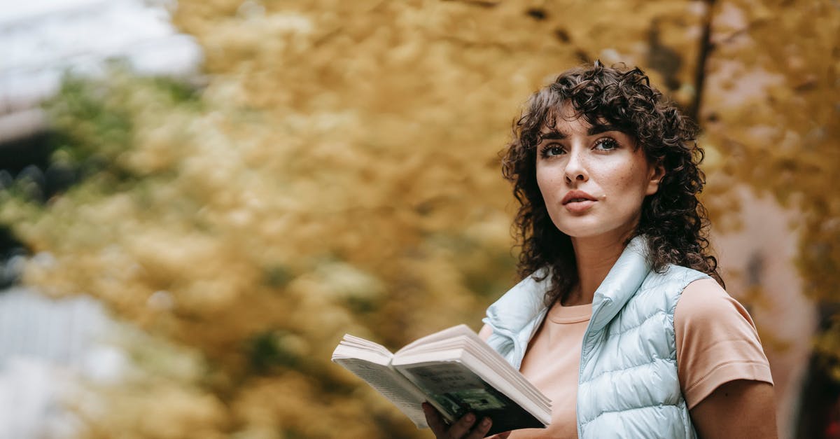 Why important characters from Mortal Kombat: Legacy season one doesn't appear in season 2? - Pensive woman with curly hair standing with book against autumn tree