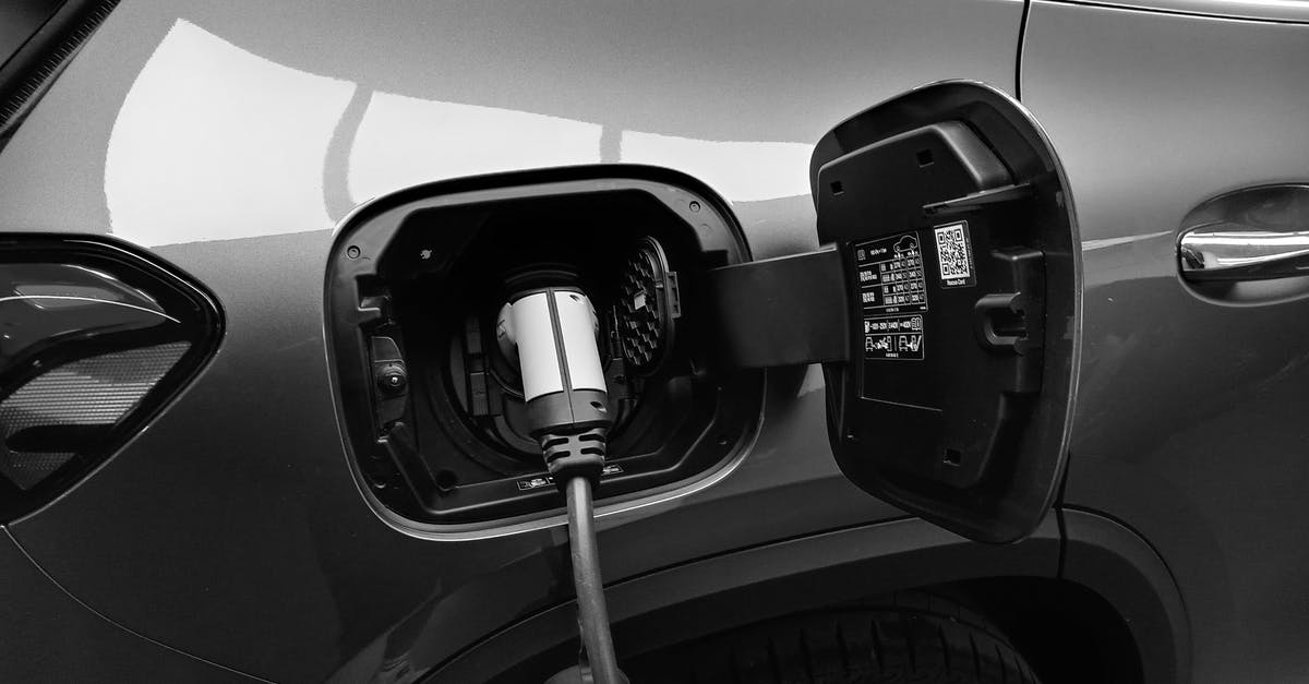 Why is being a hybrid a curse? - Monochrome Photo of Hybrid Car charging