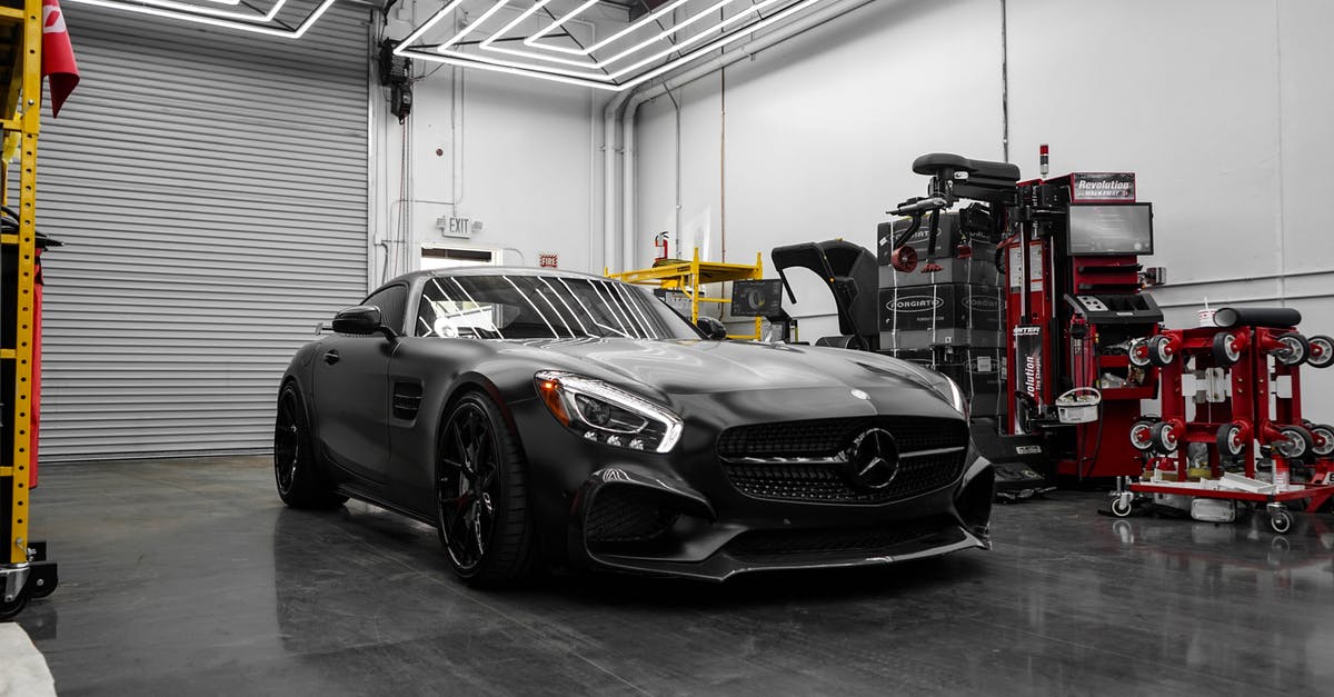 Why is being a hybrid a curse? - Matte Black Mercedes Benz Parked in a Garage