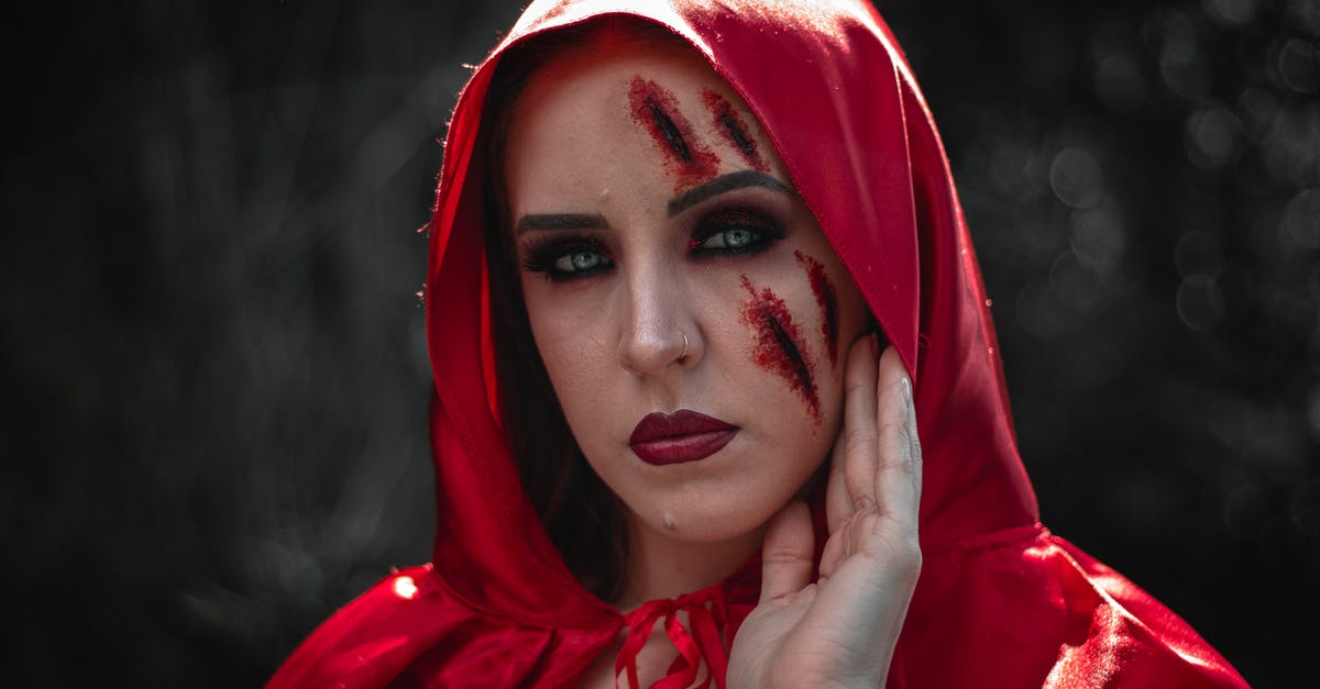 Why is Childress' face scarred? - Woman Wearing Red Hood With Makeup 