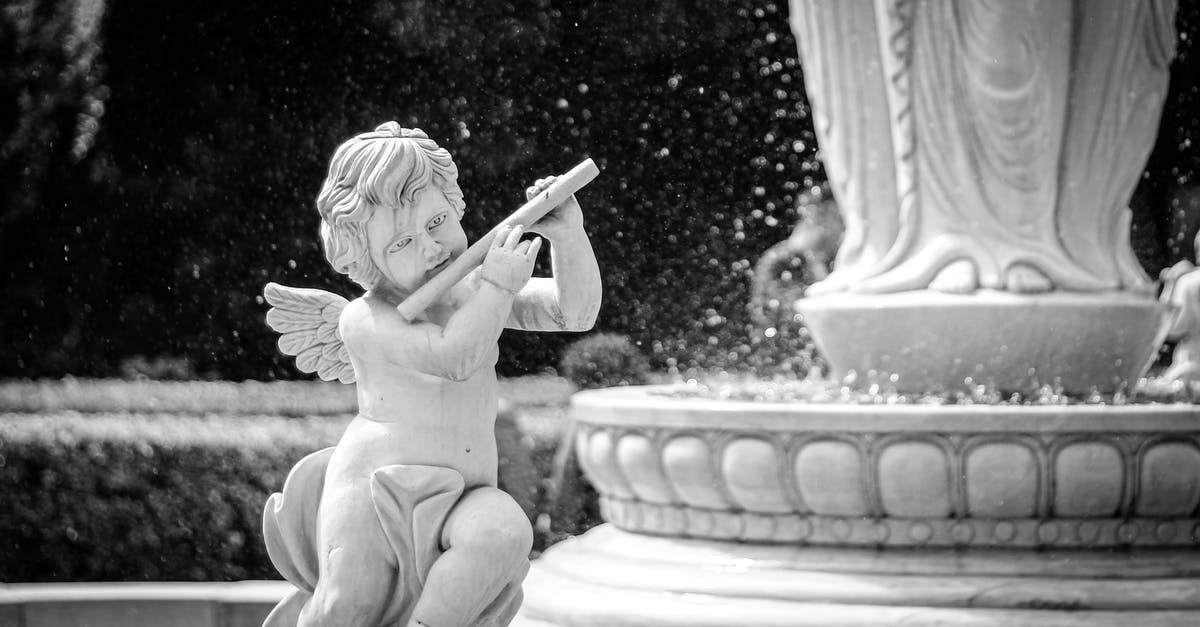 Why is Drunken Angel considered to be a masterpiece? - Angel Holding Stick Statue in Grayscale Photography