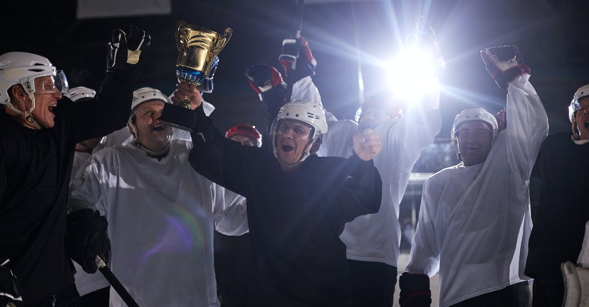 Why is Game of Thrones aimed at such a mature audience? - A Group of Men Celebrating their Win on a Hockey Competition