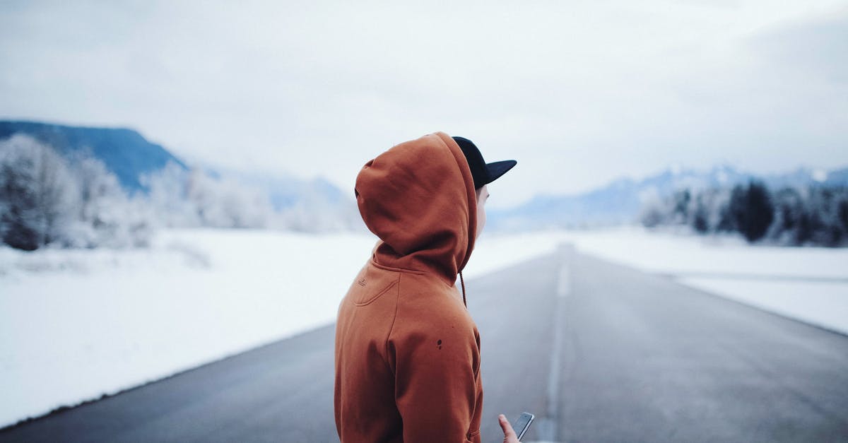 Why is Jack frost dressed in a hoodie? - Man Wearing Brown Hoodie in Road