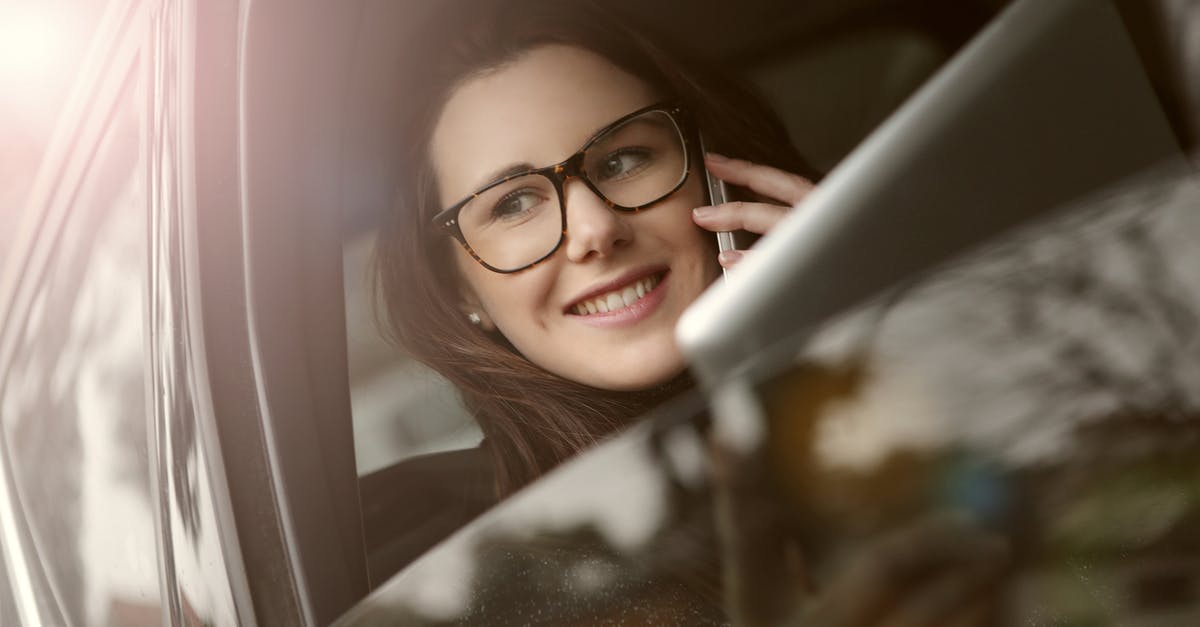 Why is Locke always busy with phone calls from the beginning to the end of the movie? - Female in glasses with tablet talking on smartphone while sitting in car with opened window